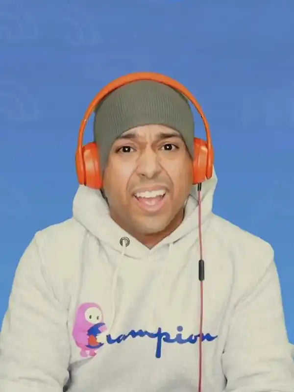 man wearing an white Champion hoodie featuring the Fall Guys