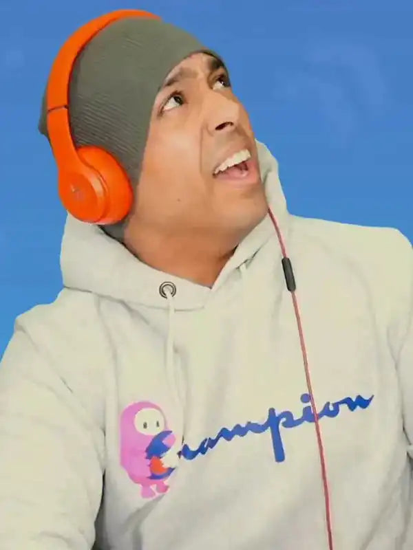 Closeup of a man wearing the white Champion hoodie with Fall Guys logo