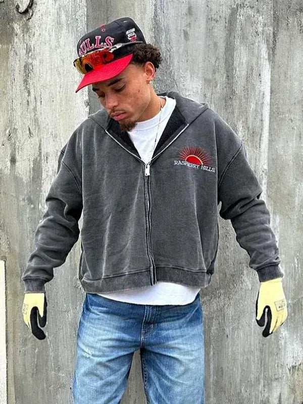 Full view of grey zip-up hoodie, with 'RASPBERRY HILLS' text