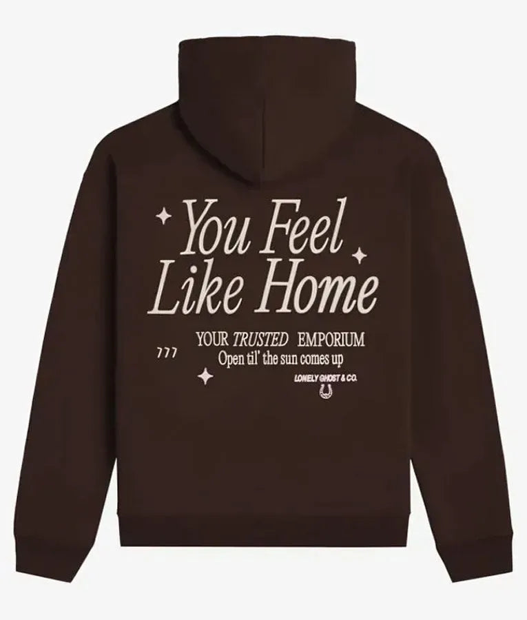 Back view of a dark brown pullover white text 'You Feel Like Home'