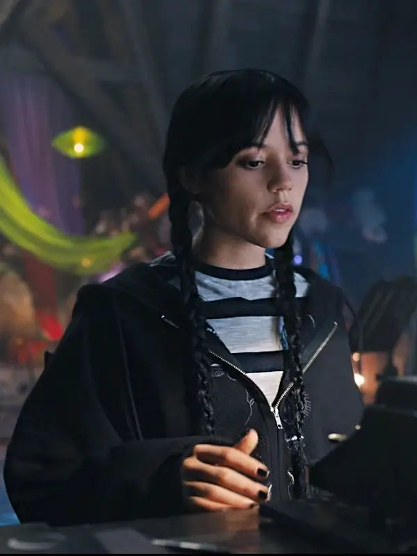 Close-up front view of Jenna Ortega as Wednesday, featuring the black zippered hoodie