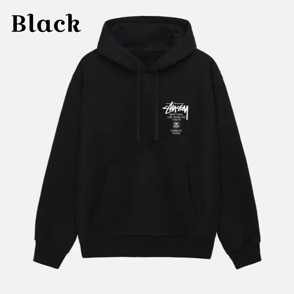 Front view of a black pullover hoodie featuring Stüssy World Tour logo