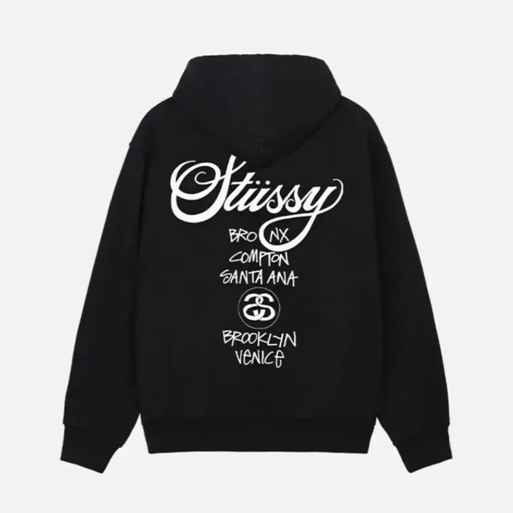 Back view of black hoodie featuring featuring Stüssy World Tour Text