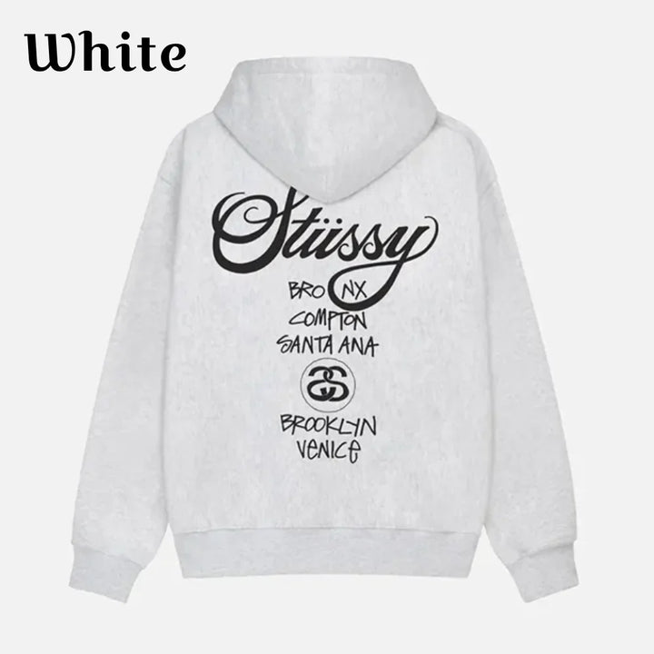 Back view of a white pullover hoodie featuring Stüssy World Tour Logo
