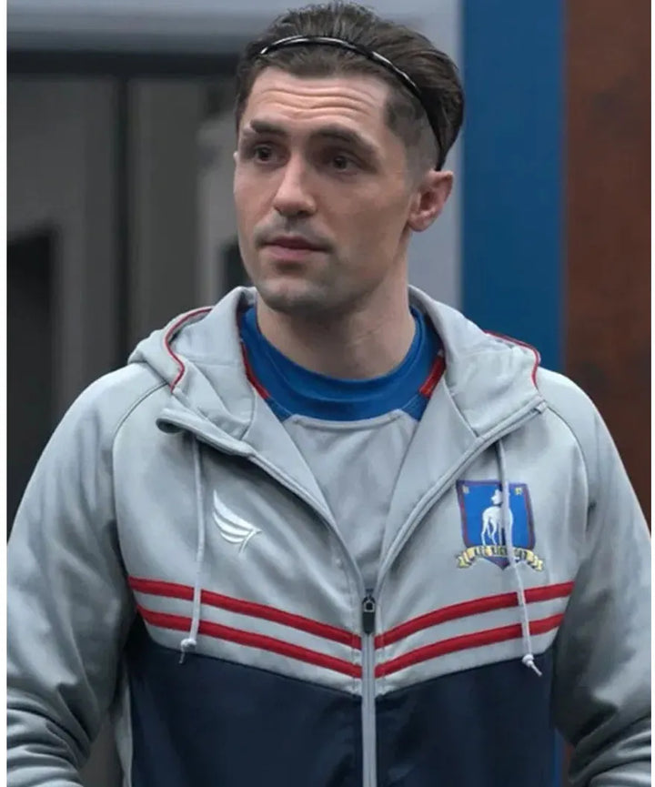 Front view of Phil Dunster wearing a grey AFC Richmond zip-up jacket