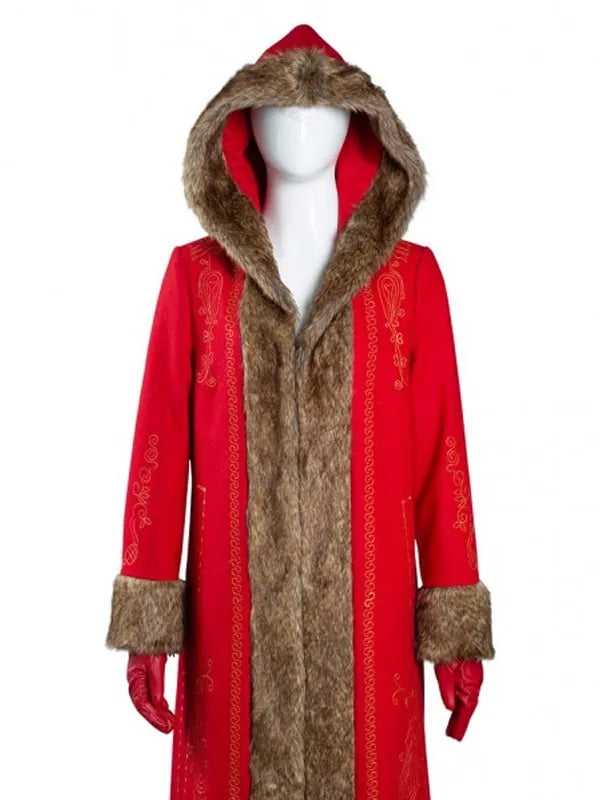Close-up of a red coat with the hood up, showing the thick brown fur trim