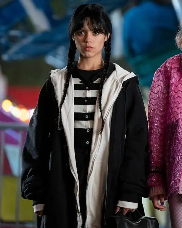 Front view of Jenna Ortega wearing a black zippered hoodie