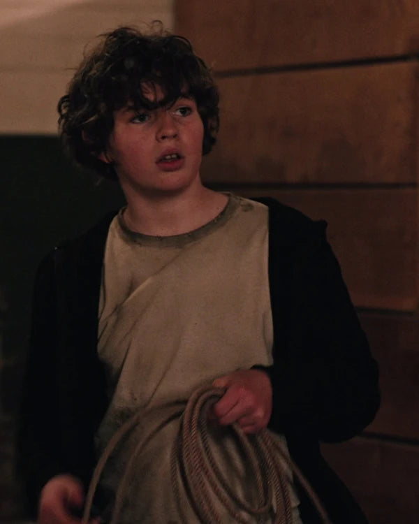 Close-up front view of Tate Dutton from Yellowstone, wearingblack zip-up hoodie