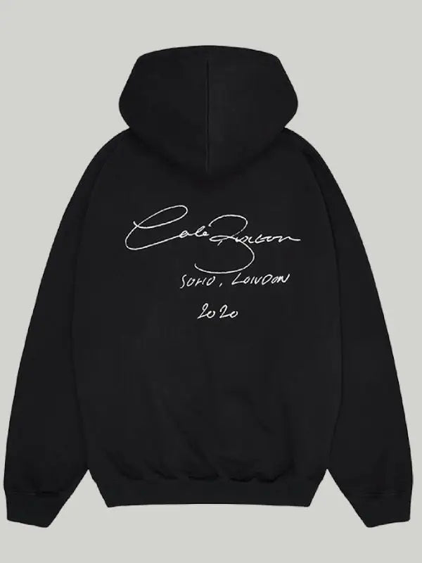 Back view of black hoodie, featuring                          'SOHO, LONDON 2020' text